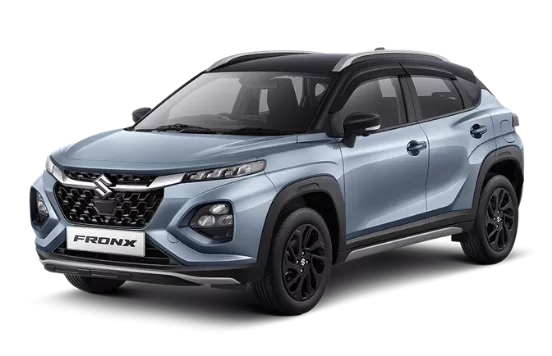 SUV Suzuki Fronx biru muda dengan atap hitam, tampilan depan samping, siap melaju di jalanan Kota Batam, dari Suzuki Indomobil Batam.